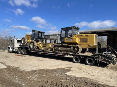 image of two mulchers on a truck for Midstate Land Clearing and Forestry Mulching LLC